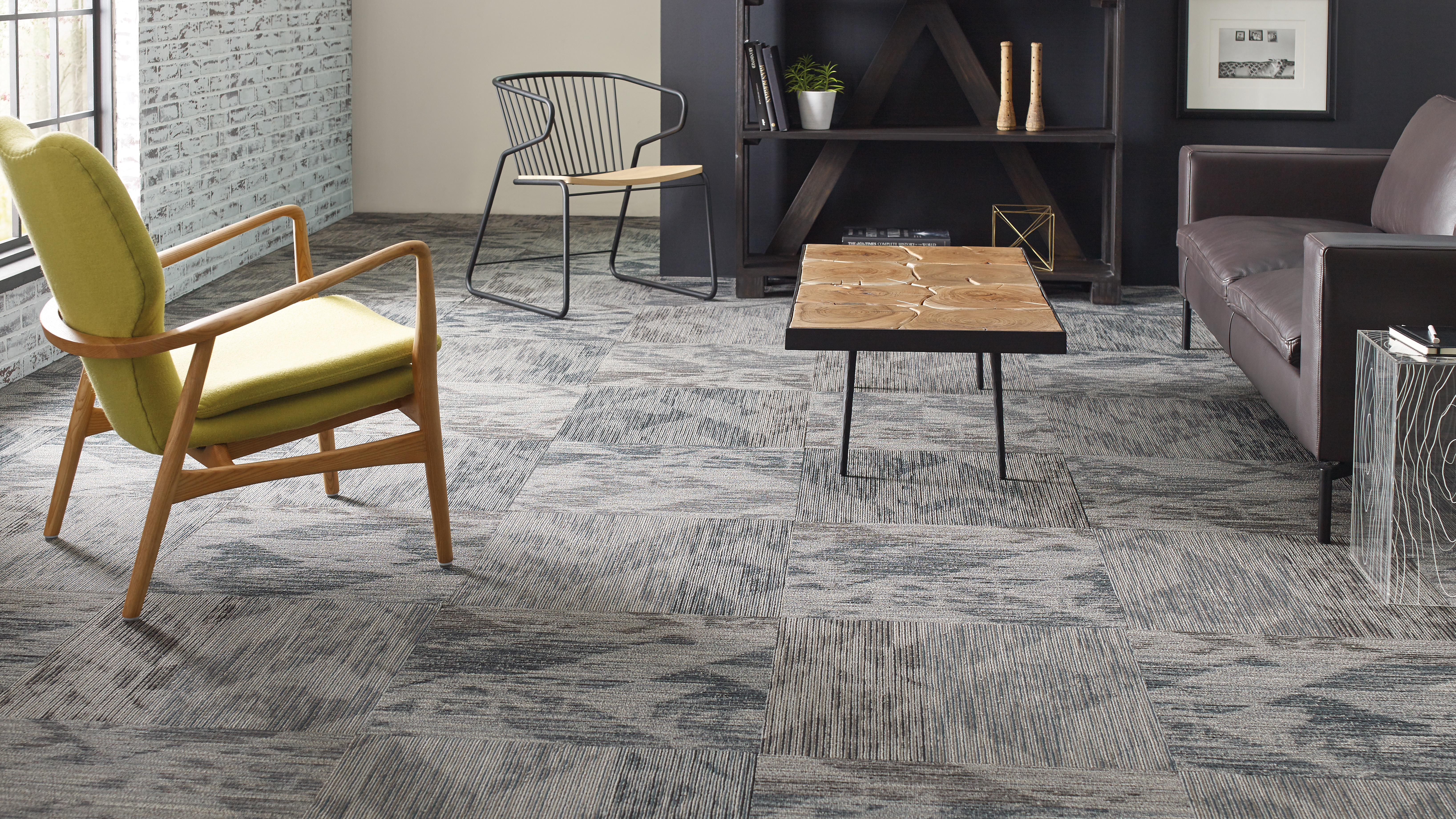 Patterned carpet installed in a den within a home 