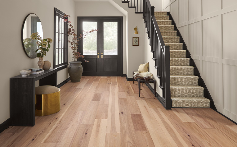 entryway hardwood with stairs on the right side