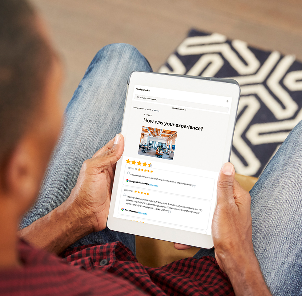 customer reading online reviews for OC Floor Gallery